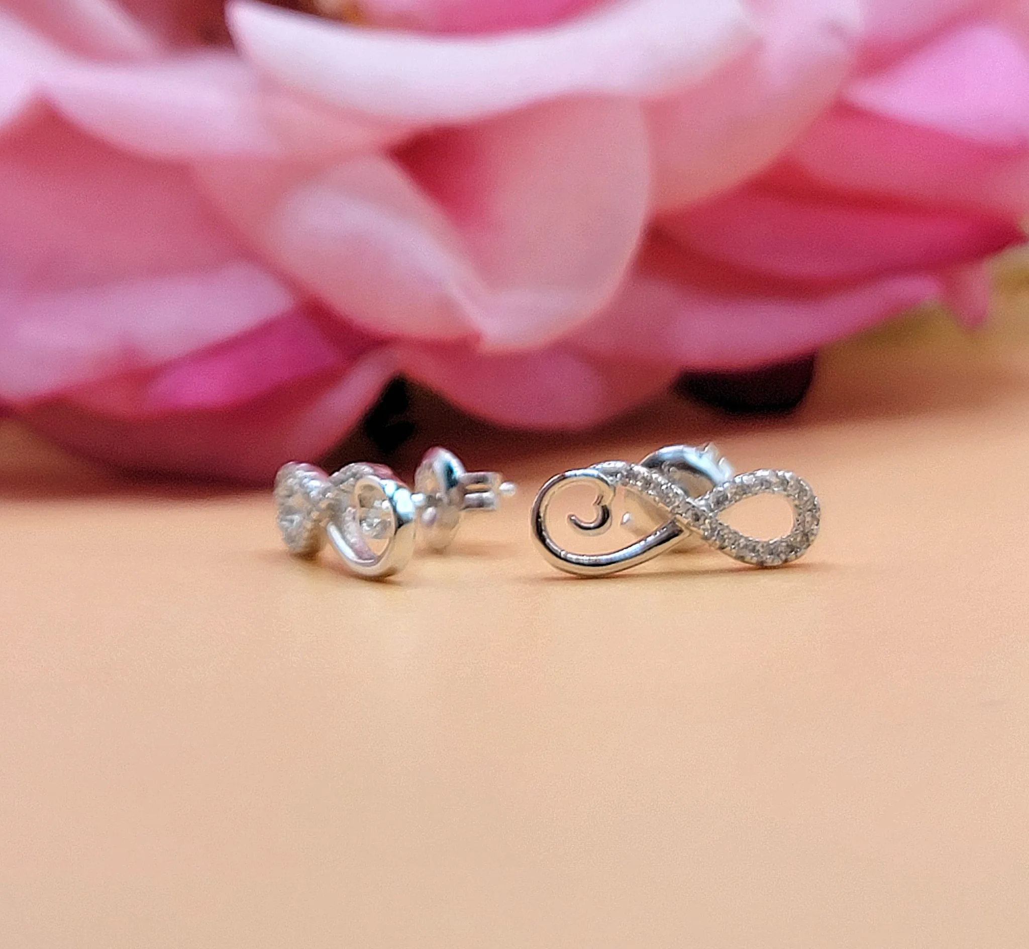 A607 Infinity Half Diamond Accent Post Earrings
